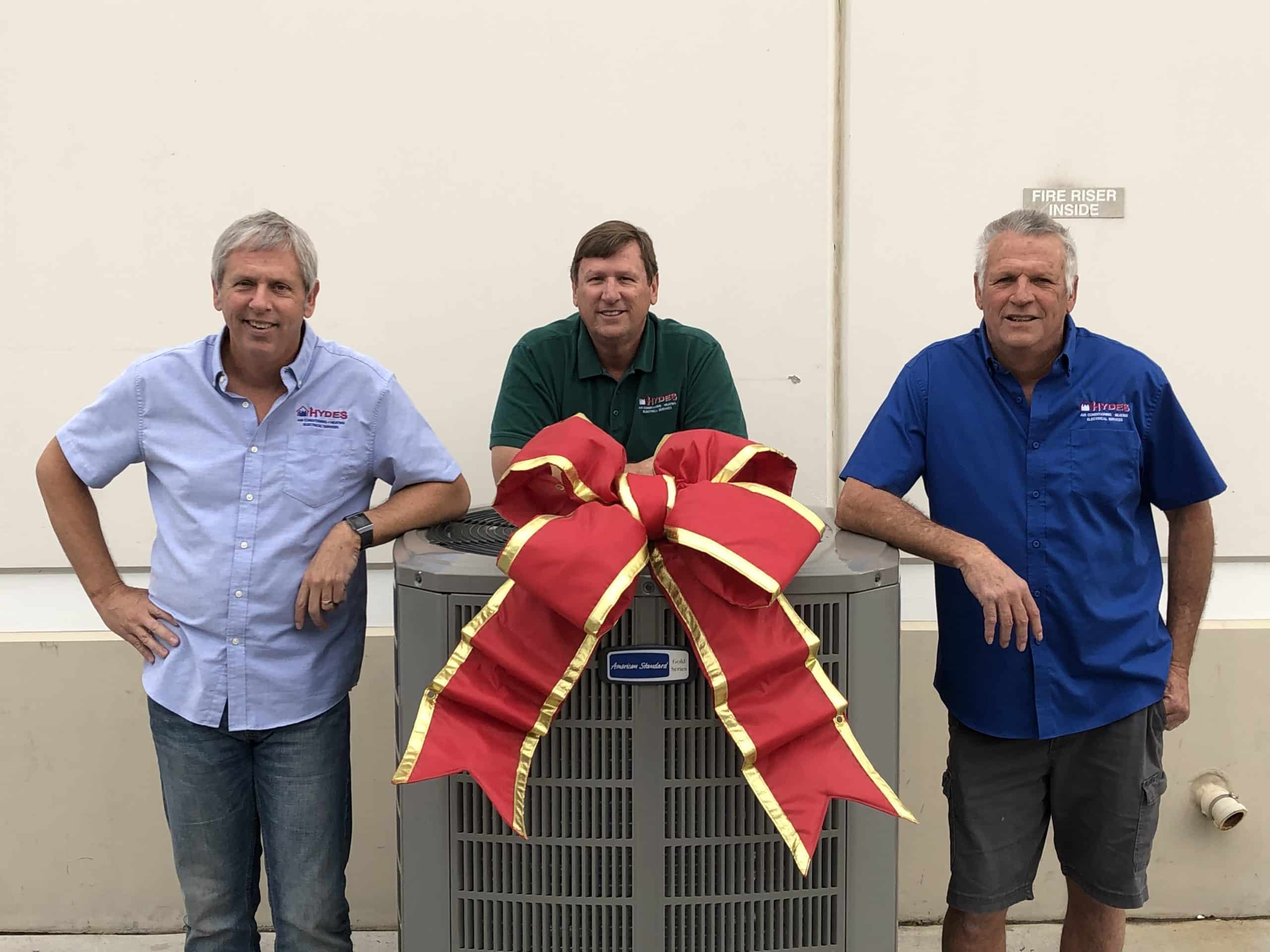 CelebrateofGiveBroPho2019 Hydes Brothers in front of Gift of Cooling HVAC system Giveaway