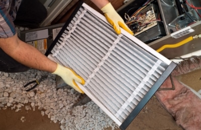 Air Filter Being Held