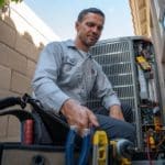 Hydes Nate Certified Technician Fixing Heat Pump